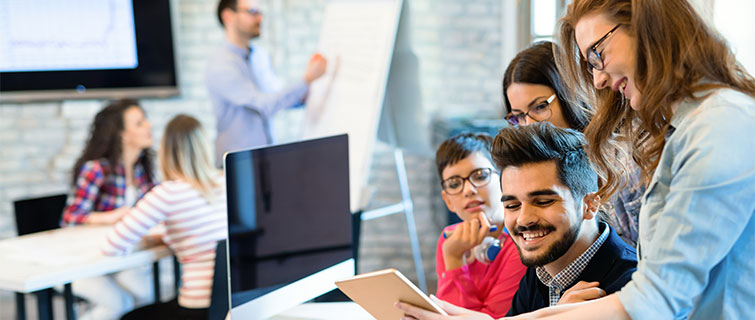 Group of business people reviewing material.