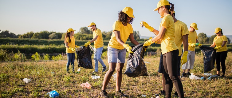 Group of people picking up trash