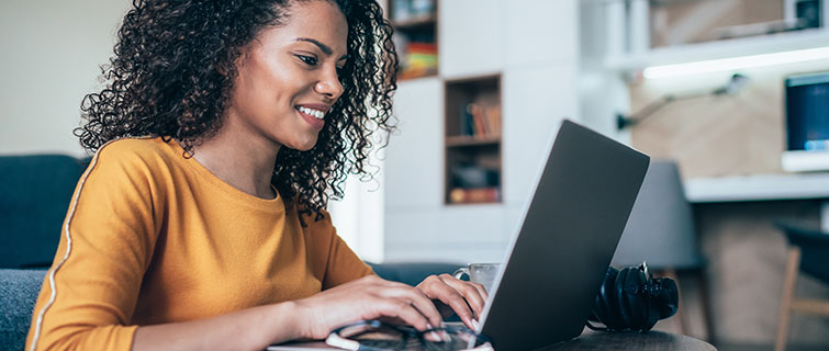 Young woman typing on her laptop.