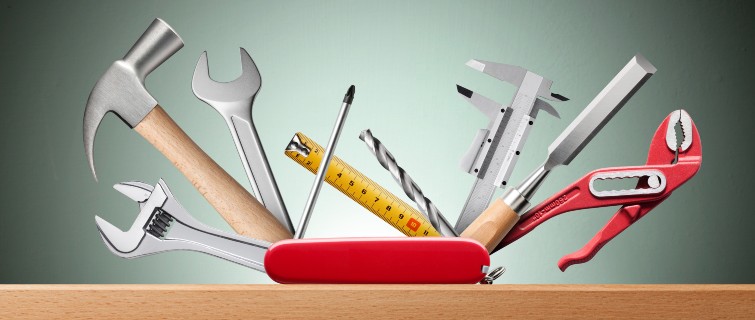 Swiss Army knife displaying tools including a hammer and wrenches.