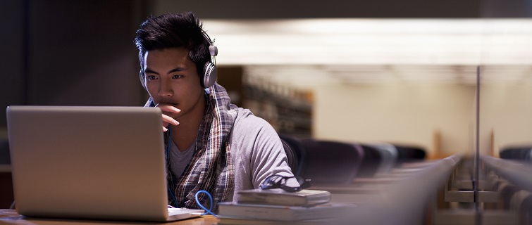 Man studying in empty library