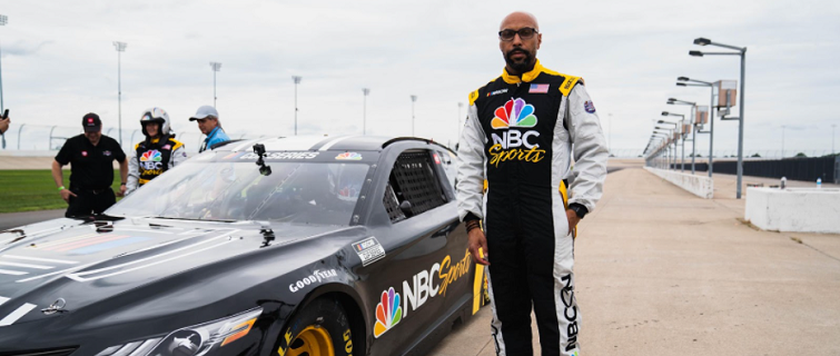 Erik Moses standing in front of car