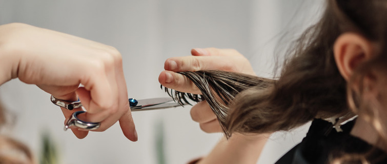 Hands cutting hair