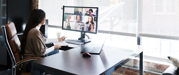 Woman meets with colleagues virtually