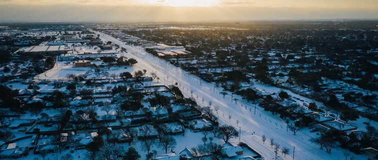 Aerial image of houses covered in snow