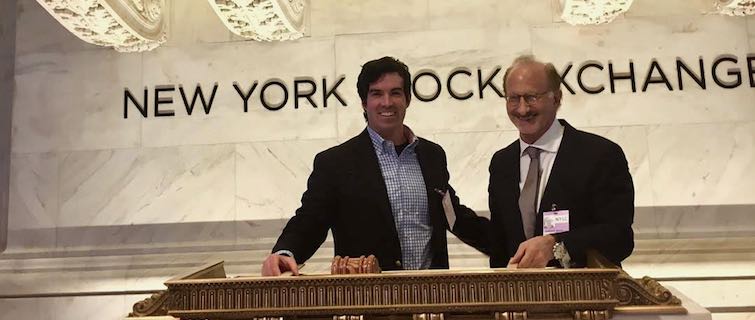 Alex Pettee and Capstone advisor Jonathan Morris ring the bell on Wall St.