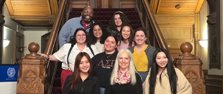 Amanda Reich with classmates standing on stairs.