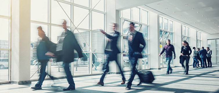 Business people walking through an airport