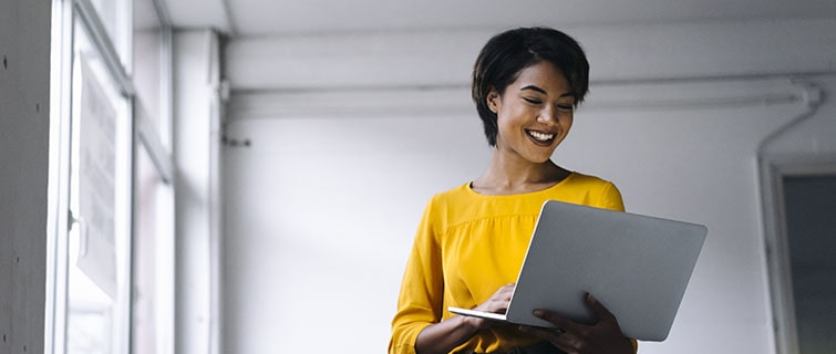 woman looking at her laptop