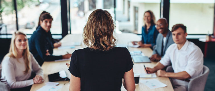 Woman talking to a meeting group