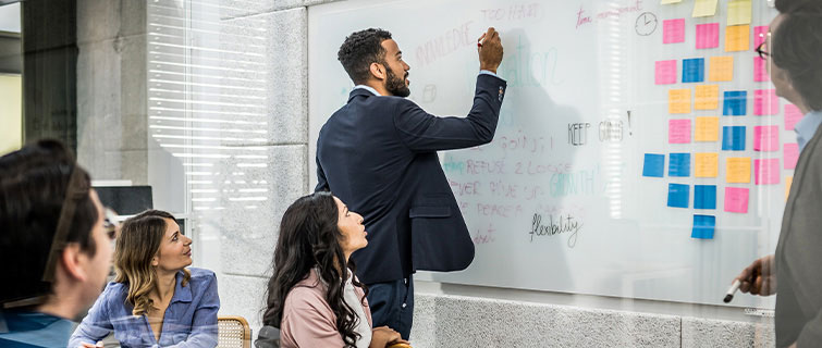 Man writing on whiteboard