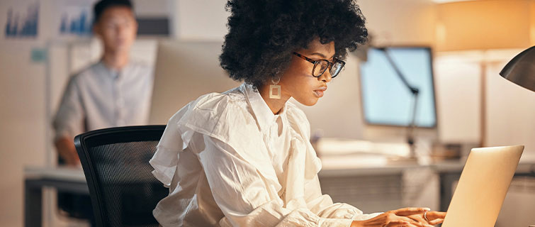 Woman typing on laptop