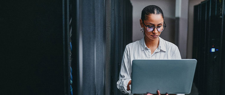 Woman looking at laptop