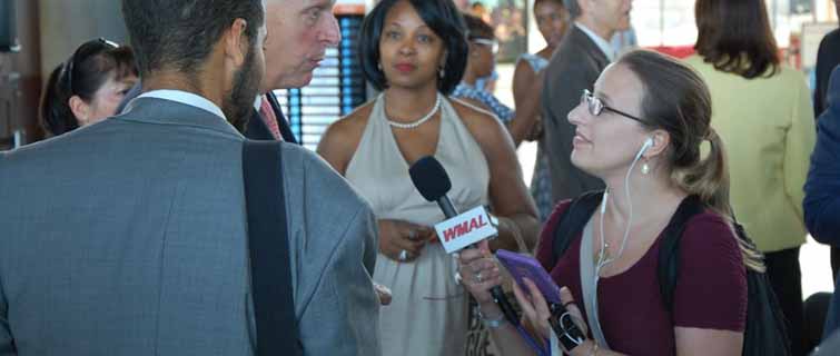 Heather Curtis interviewing people