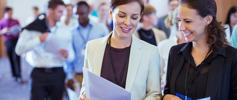 People talking at a networking event