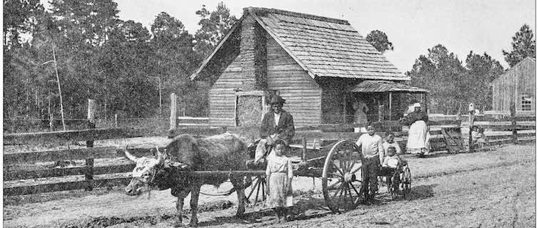 family of farmers in their wagon