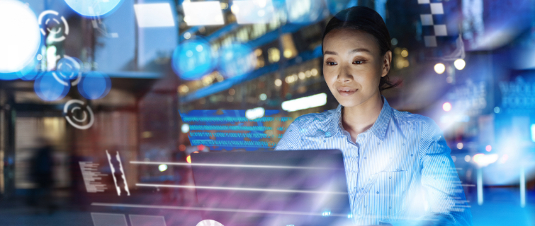 Businesswoman using AI on smart phone and laptop for work