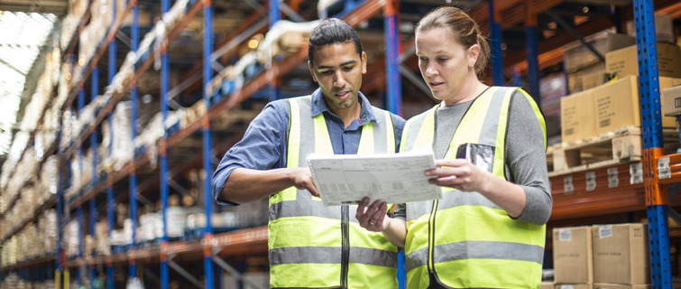 Manager and worker inside a food distribution warehouse