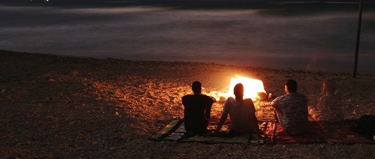 People around a campfire, telling stories