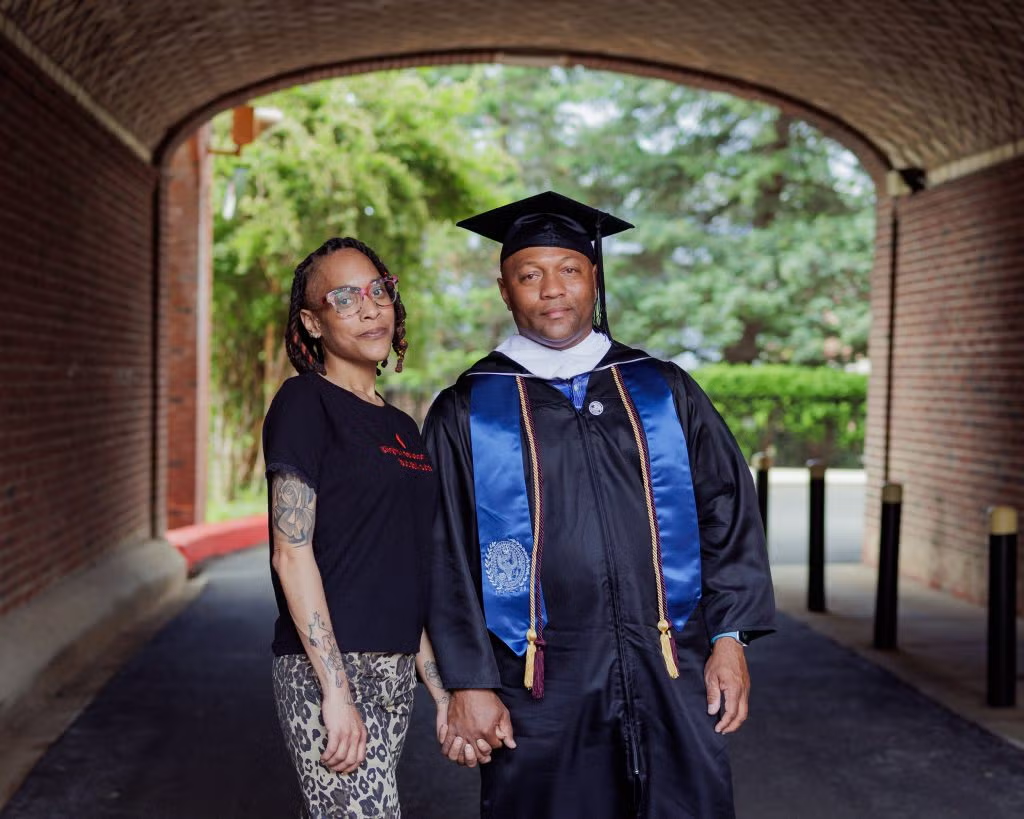 Walker (right) with his daughter Tyana Walker, who attended his graduation on May 15.