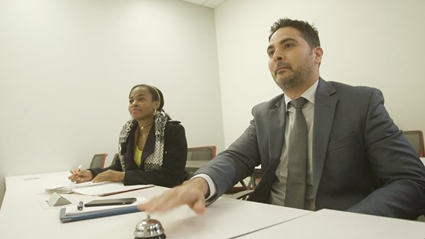 Students sitting in a classroom ready to answer questions