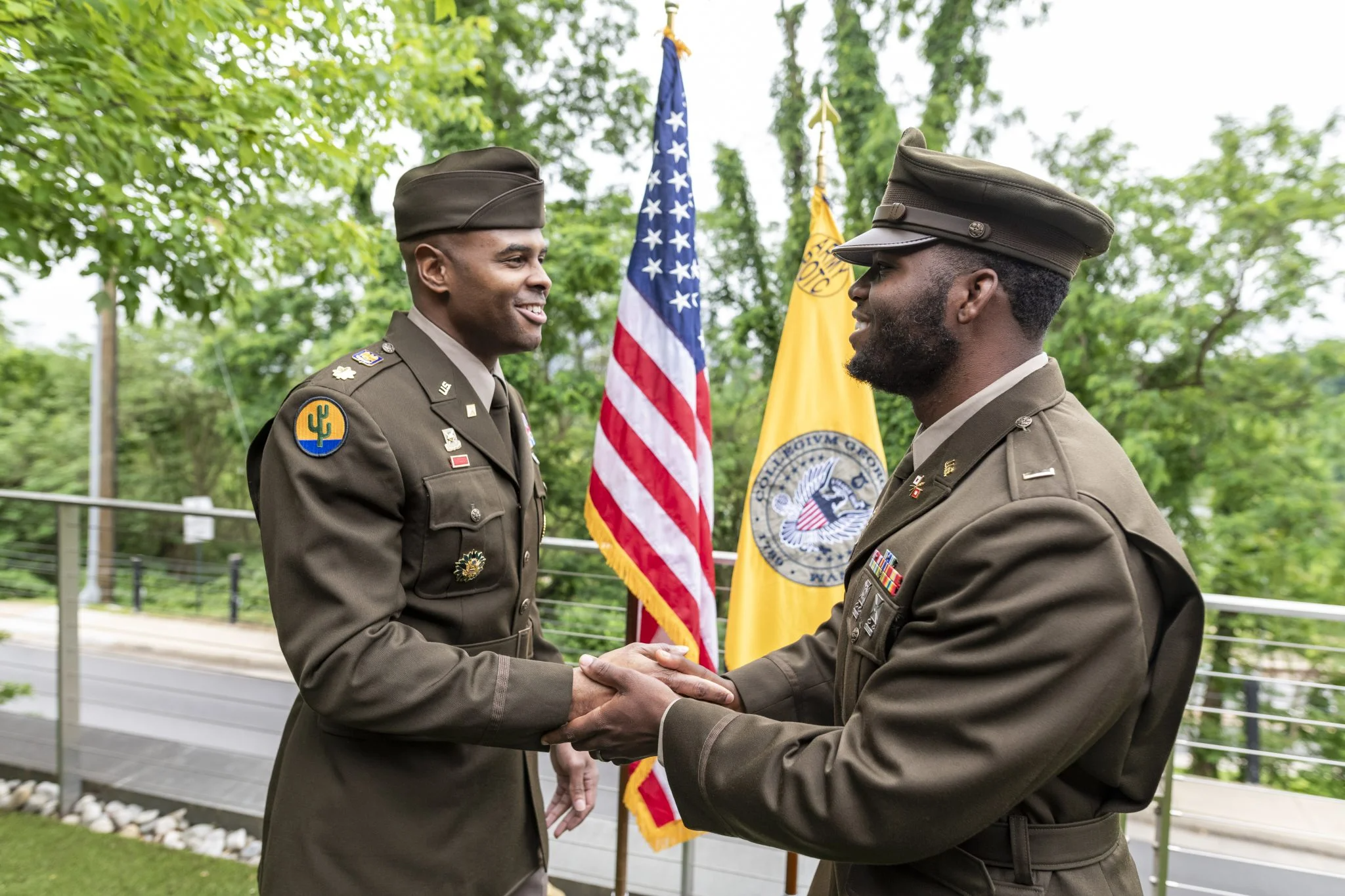 Maj. Darius Hinton, a personal friend and mentor, administers Lester Mungro’s officer’s oath.