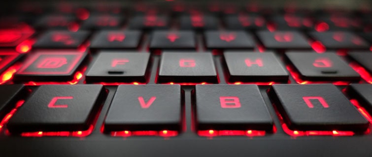 laptop keyboard with red colored lit up keys