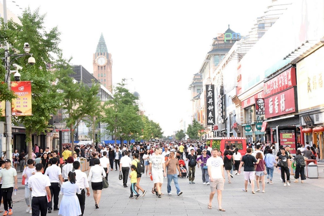 People in the middle of the street in Wuhan's market district