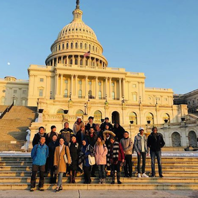 Students posing in front of the U.S. Capital.